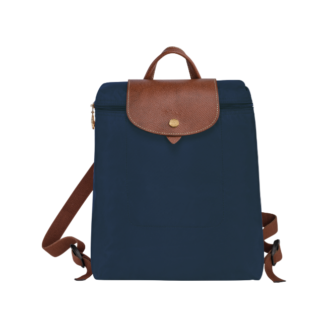Navy blue longchamp backpack with brown leather accents on a white background