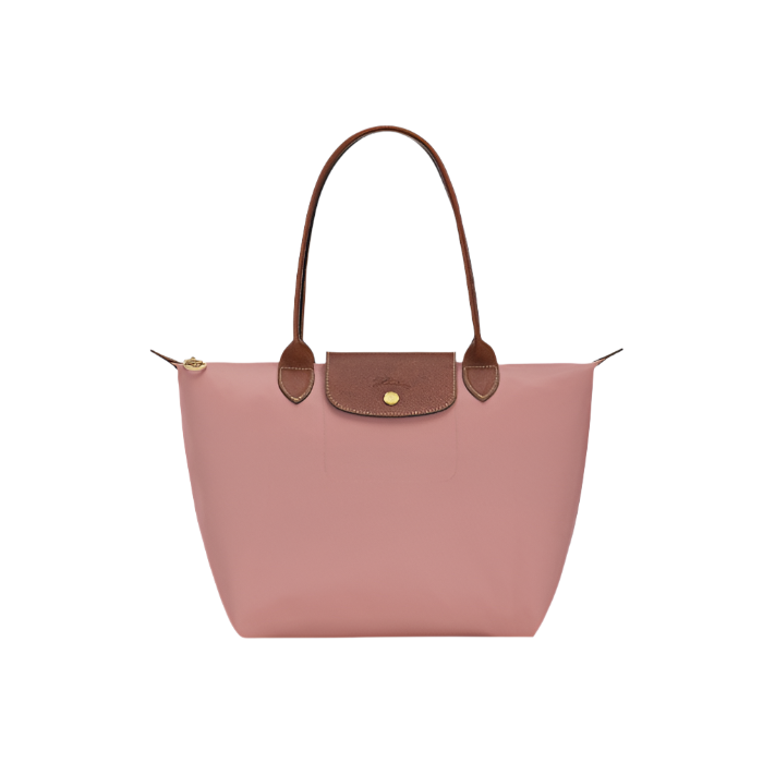 Pink tea handbag with brown handles and trim on a light gray background- pink tea purse