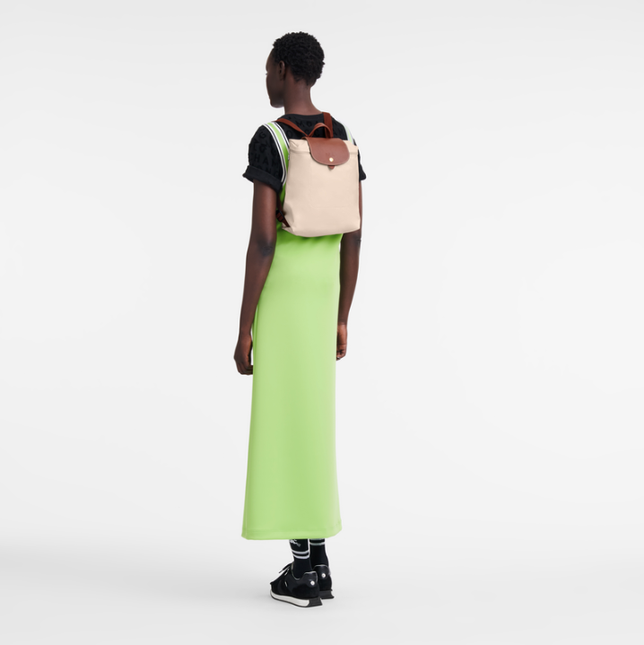 beige longchamp backpack- model wearing