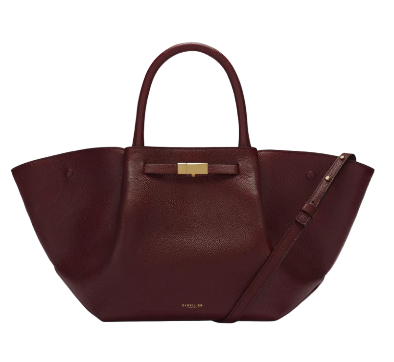 Burgundy leather midi luxury handbag with a gold clasp on a white background