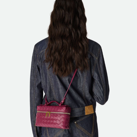 celia handbag- pink purse model holding