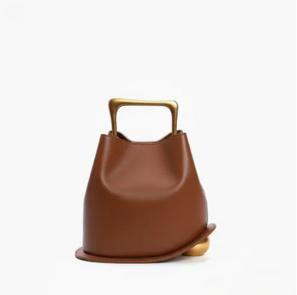 Brown leather ayla handbag with gold handle on a white background