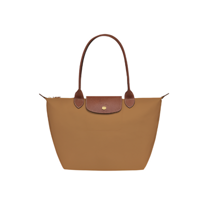 Brown handbag with brown handle and clasp on a light gray background- brown purse