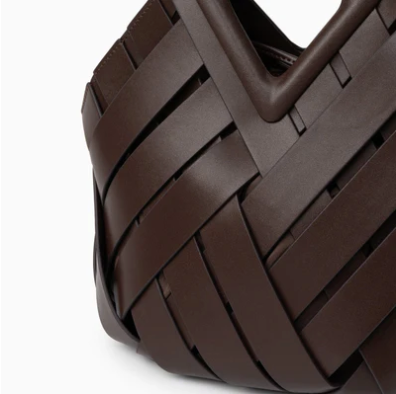 Close-up of a brown veya handbag on a white background