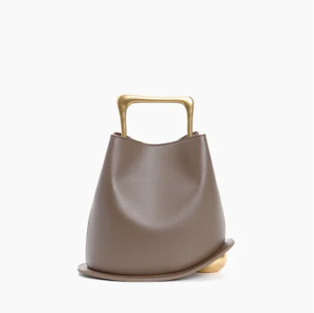 Gray ayla handbag with gold handle on a white background