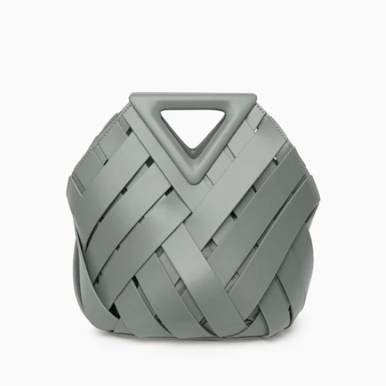 Gray veya handbag with a geometric handle on a white background