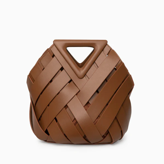 Brown veya handbag with a geometric handle on a white background