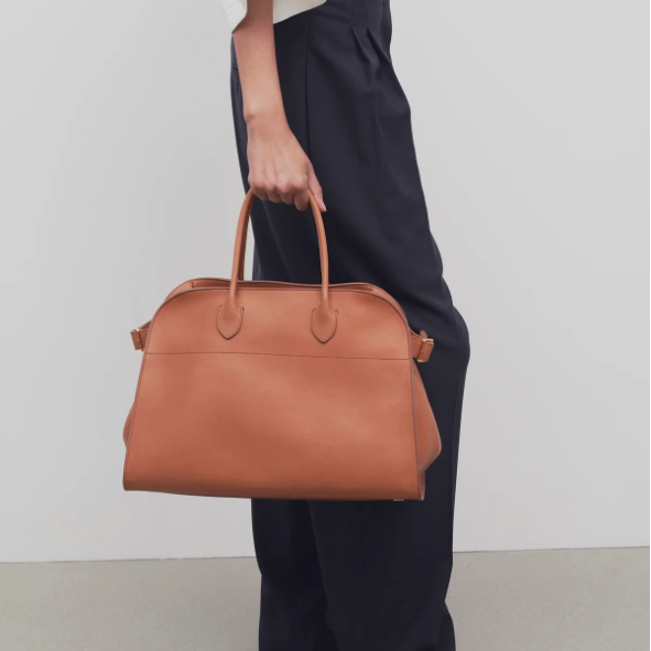 medium margaux handbag- ochre leather purse model holding
