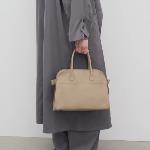 small margaux handbag- taupe leather purse model holding
